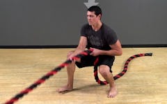 Battle Rope Exercise: Anchored Squat Stance Traveling Row