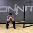Lateral Band Resisted Squat Hold Bodyweight Exercise