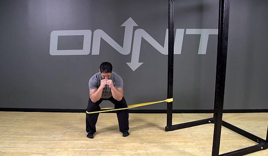 Lateral Band Resisted Squat Hold Bodyweight Exercise