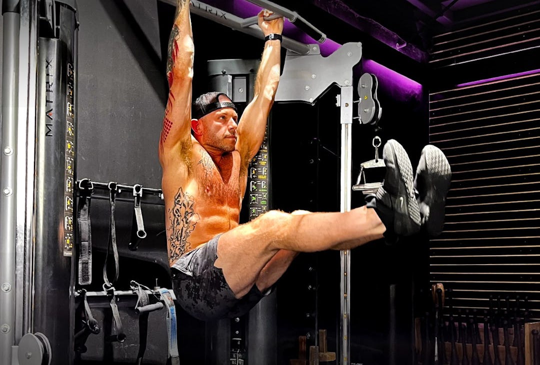Onnit Gym manager Larry Maloney demonstrates the hanging leg raise.