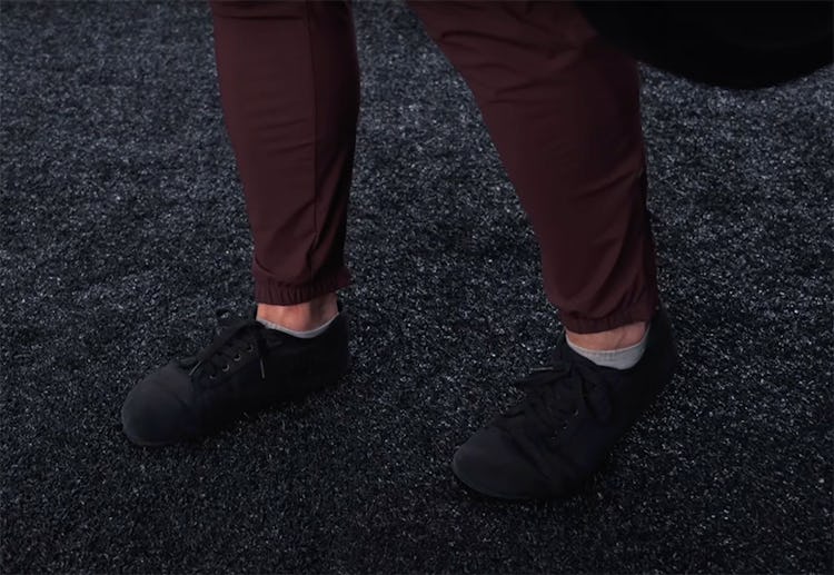 Onnit Editor-in-Chief Sean Hyson shows the correct B-stance RDL foot placement.