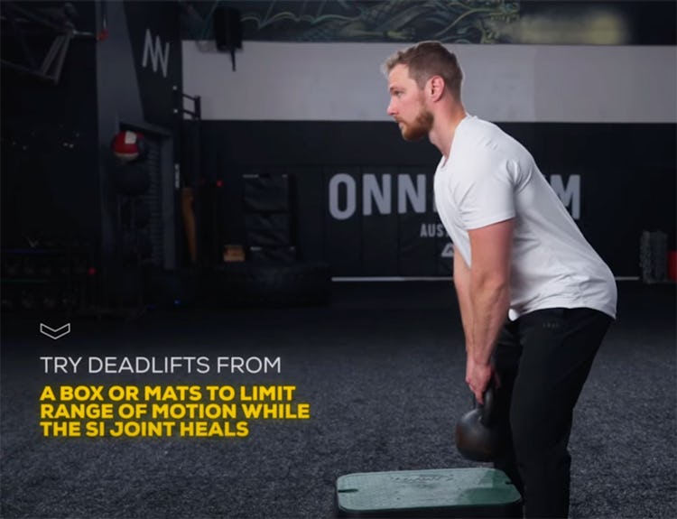 Chiropractor Layne Palm demonstrates the partial-range deadlift to prevent SI joint pain.