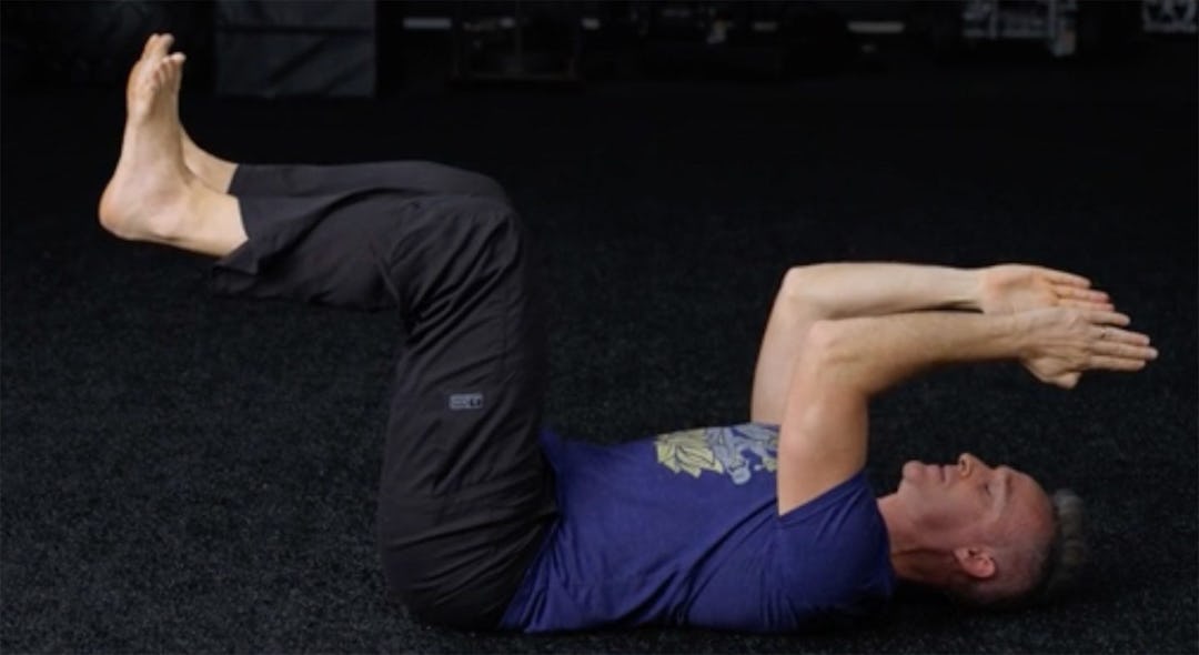 Shane Heins demonstrates the dead bug exercise.