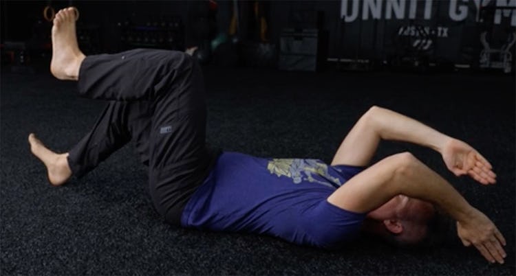 Shane Heins demonstrates the dead bug with heel and finger tap.