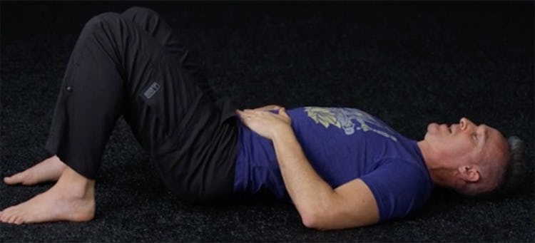 Shane Heins demonstrates the pelvic clock exercise.