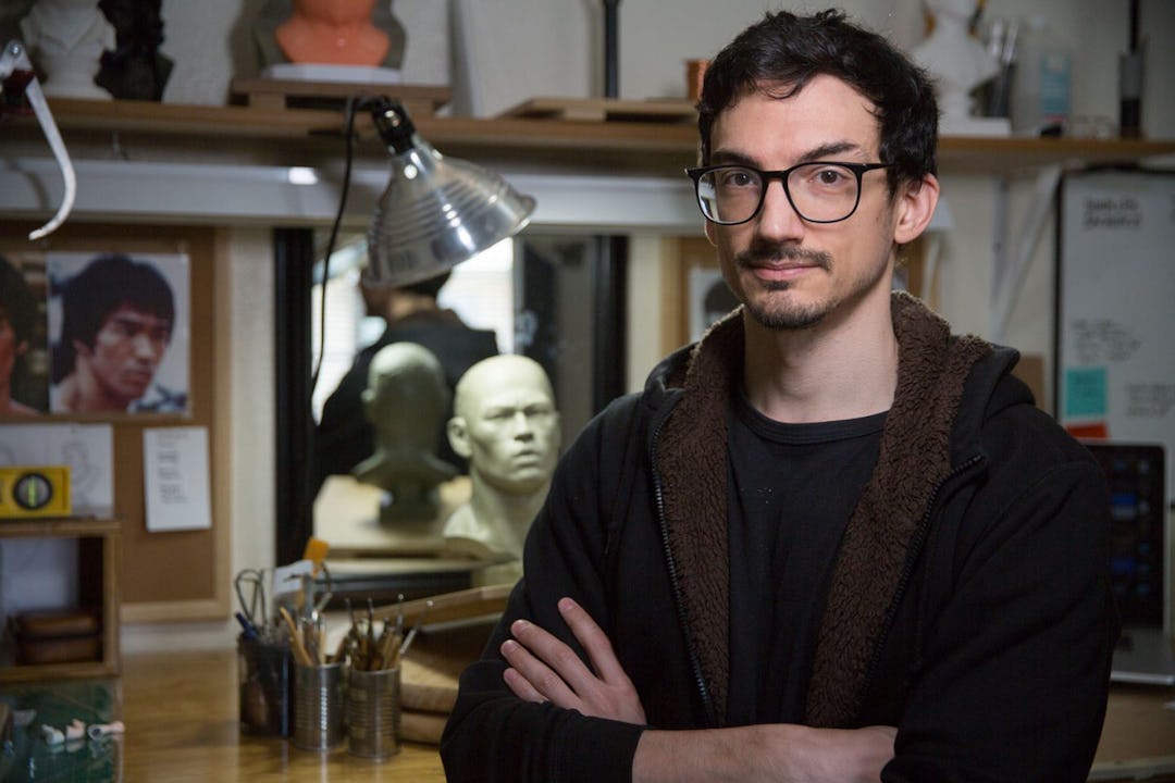 Sculptor Christopher Genovese stands in his gallery