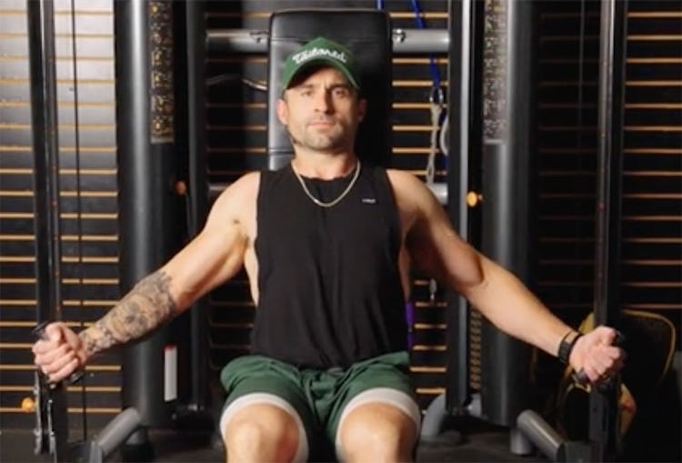 IFBB pro Jonny Catanzano demonstrates the cable crossover on a bench for the upper chest.